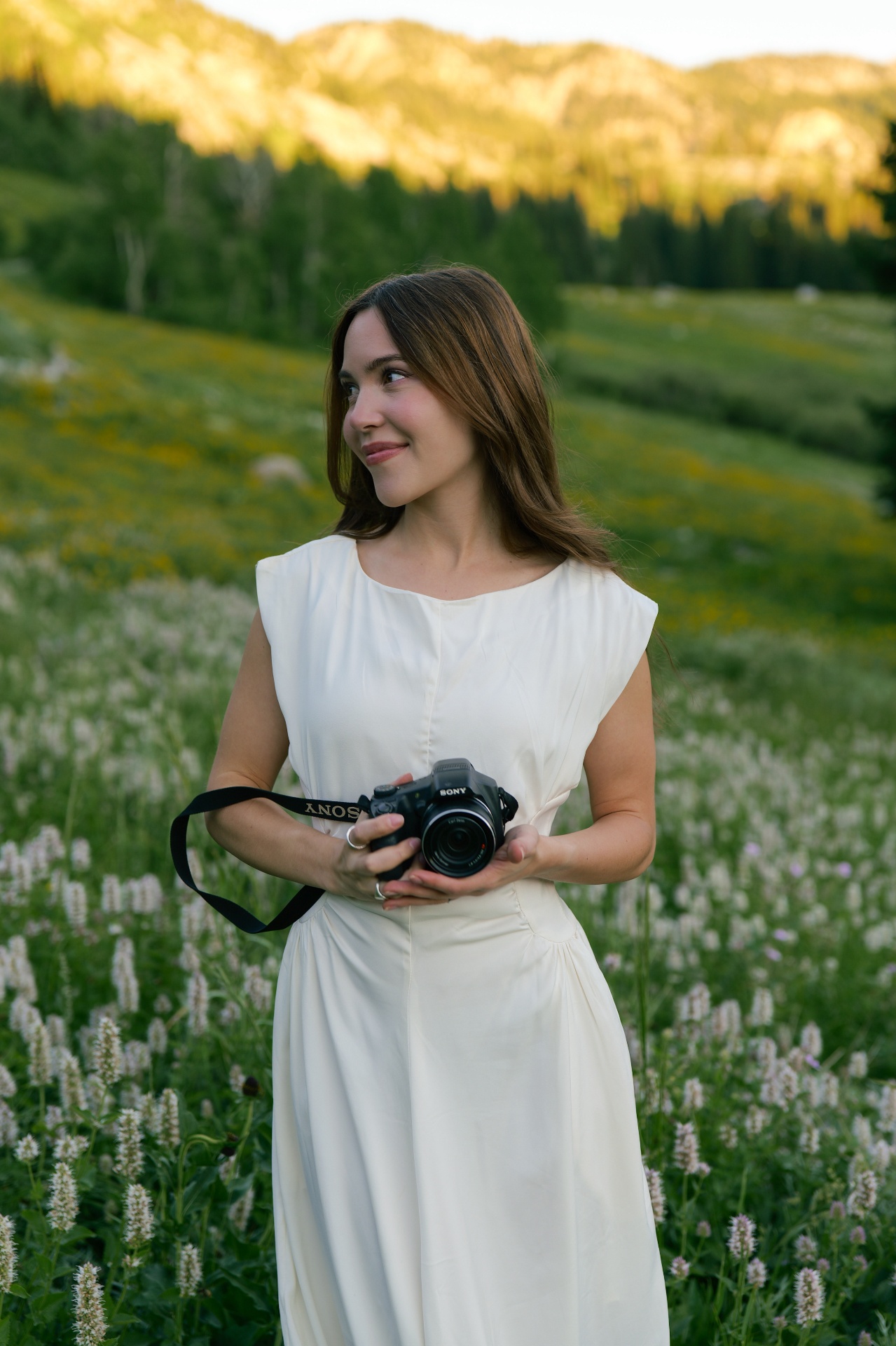 Portrait of the photographer in a mountain meadow